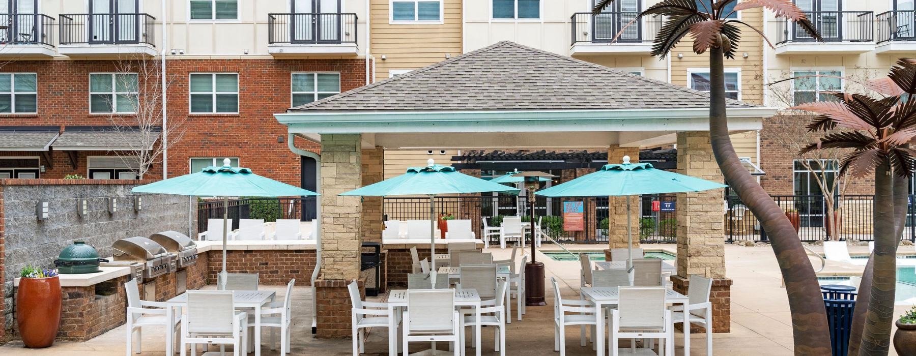 a group of tables and chairs outside of a building