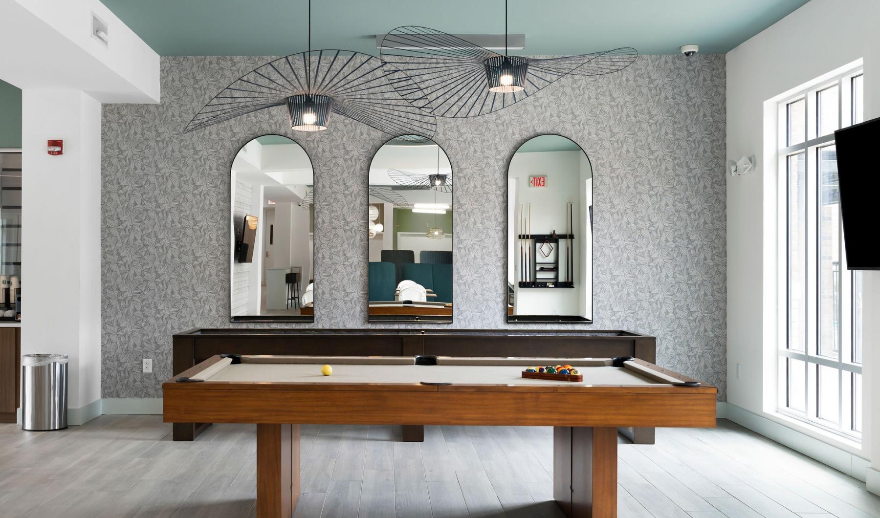 a room with a large mirror and a table